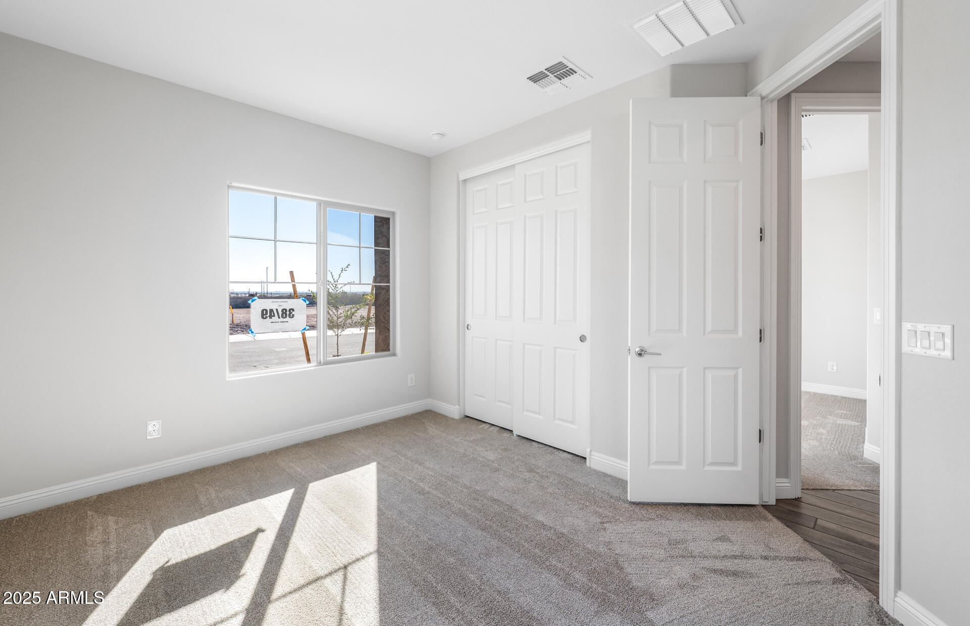 6808 West Ripken Way Florence, AZ 85132 - Photo 11 of 38 a view of an empty room with a window