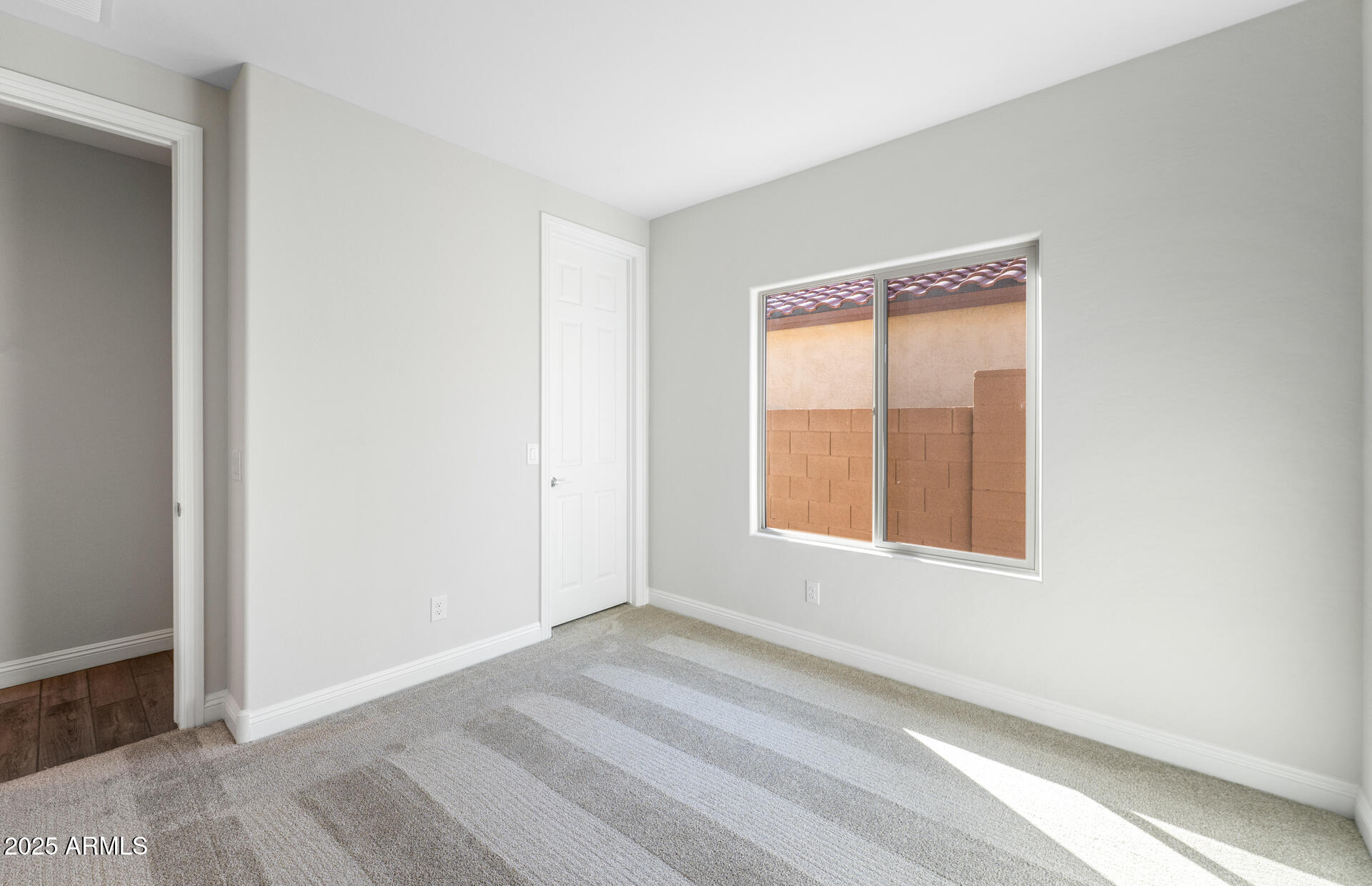 6808 West Ripken Way Florence, AZ 85132 - Photo 14 of 38 an empty room with a window