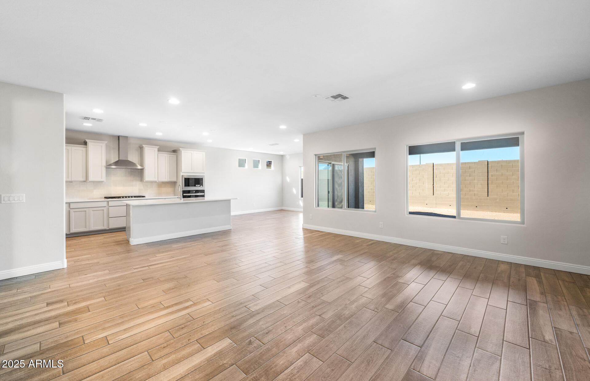 6808 West Ripken Way Florence, AZ 85132 - Photo 19 of 38 a view of a kitchen with wooden floor and a kitchen