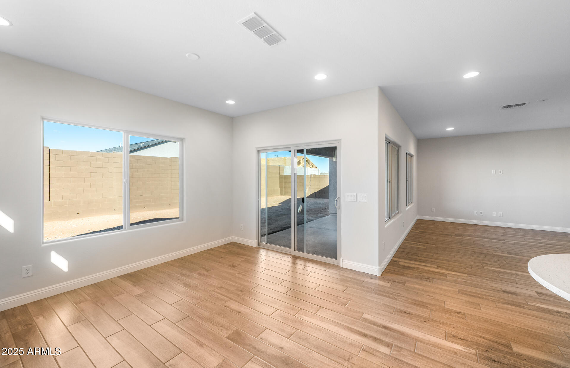 6808 West Ripken Way Florence, AZ 85132 - Photo 27 of 38 a view of empty room with wooden floor and fan