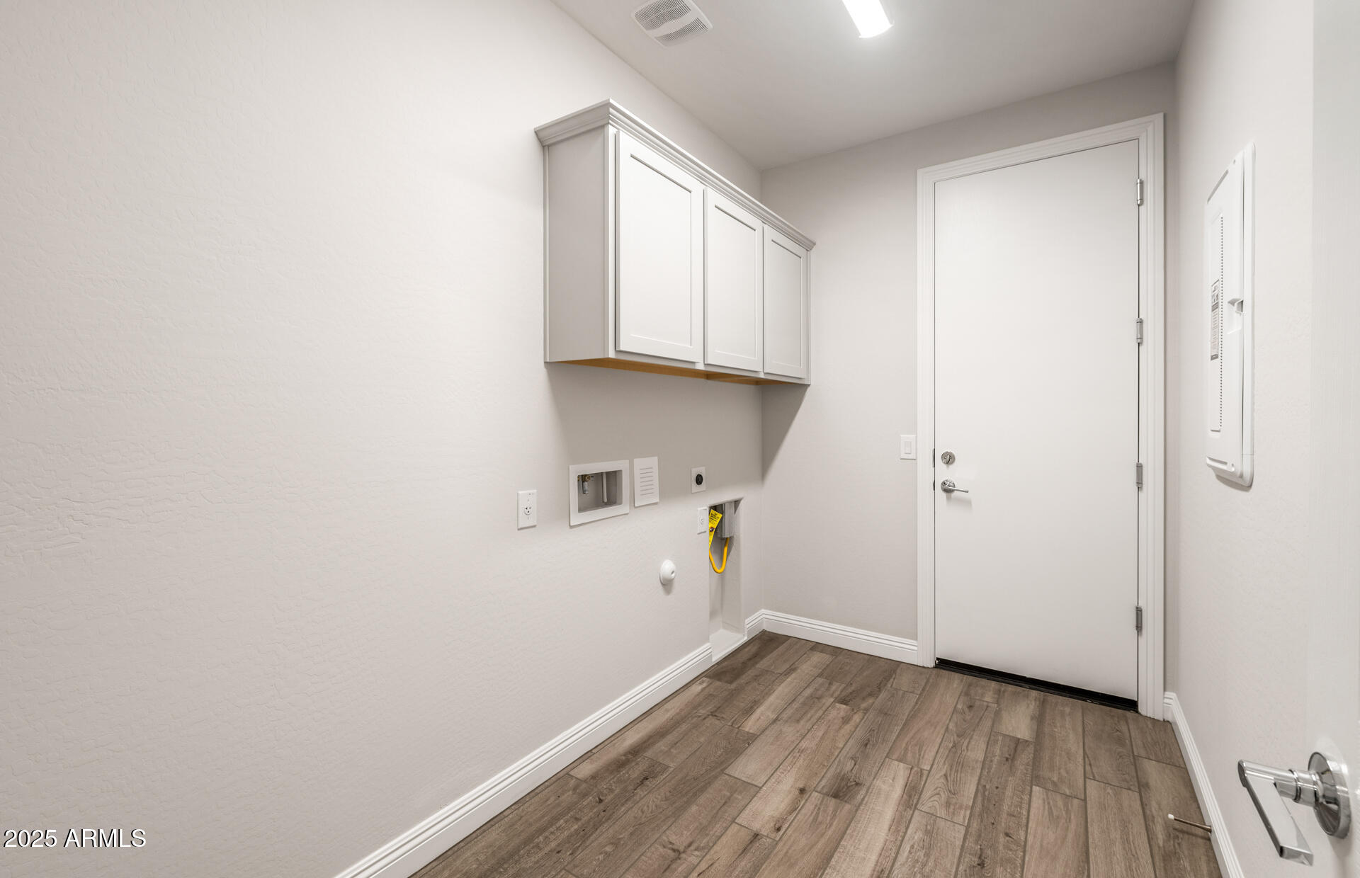 6808 West Ripken Way Florence, AZ 85132 - Photo 29 of 38 a view of kitchen with wooden floor and electronic appliances