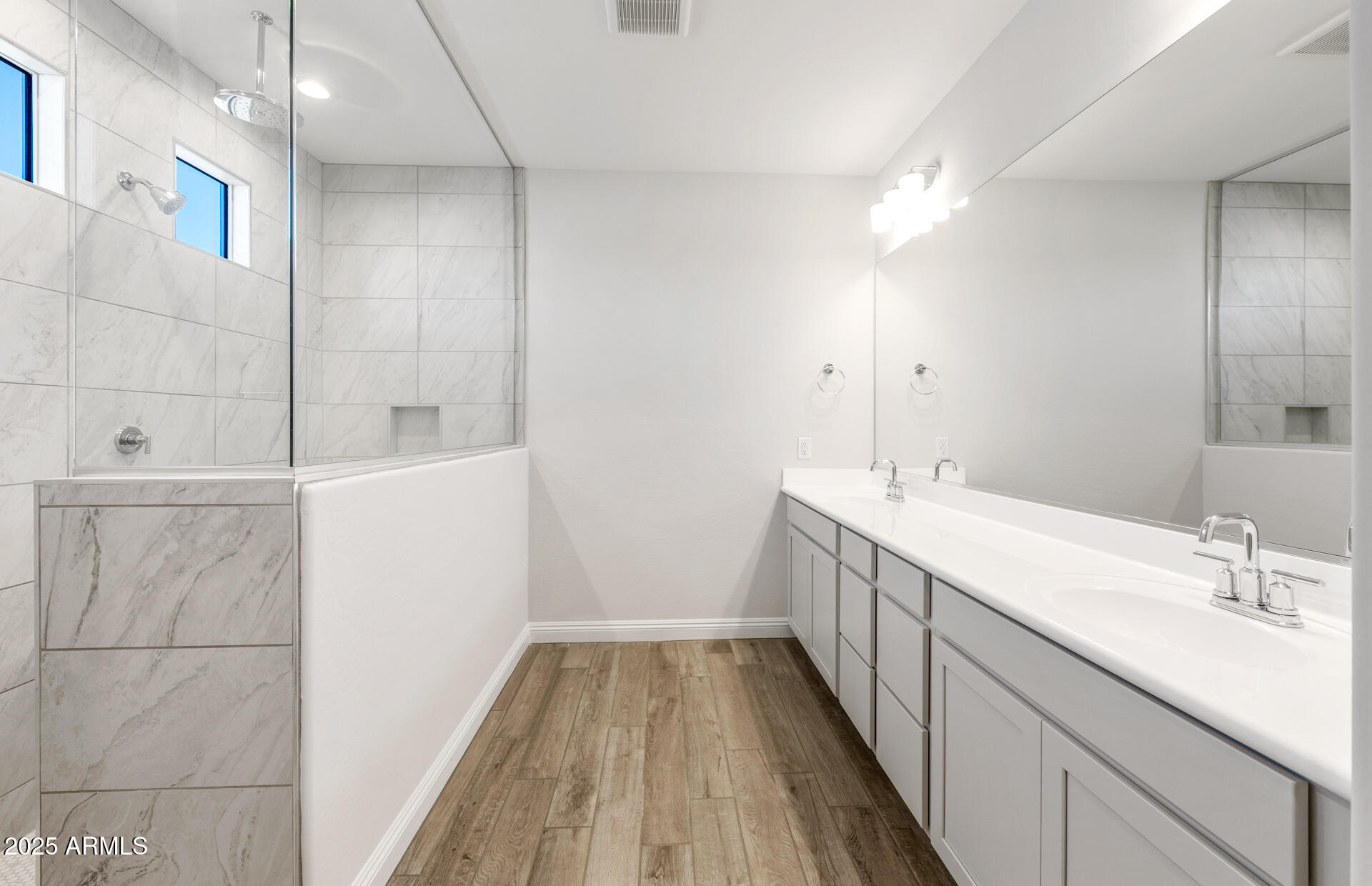 6808 West Ripken Way Florence, AZ 85132 - Photo 33 of 38 a bathroom with a double vanity sink and a mirror