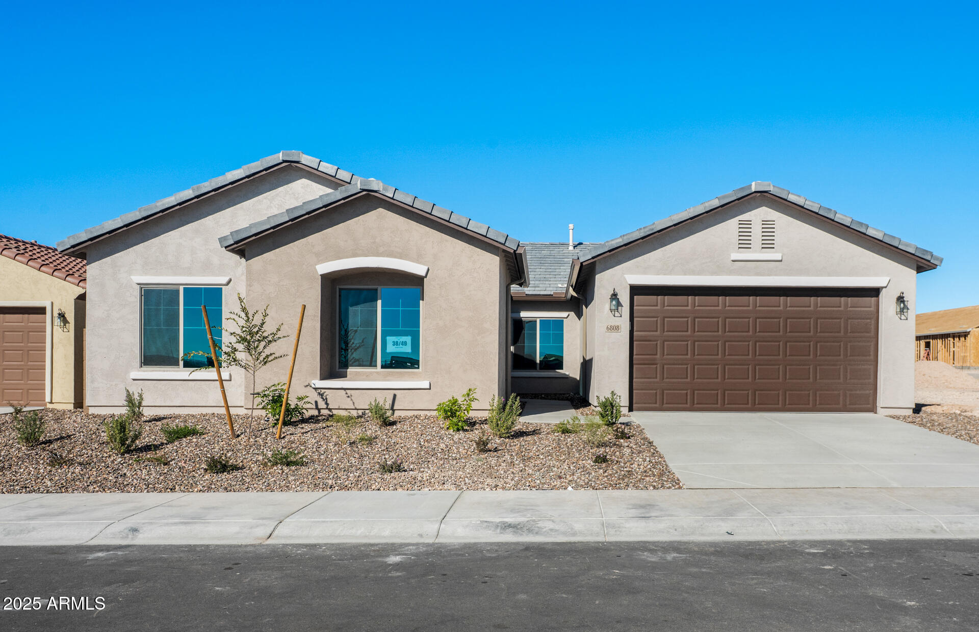 6808 West Ripken Way Florence, AZ 85132 - Photo 10 of 38 a front view of a house with a yard and garage