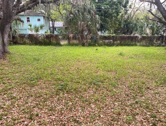 a view of patio with a yard