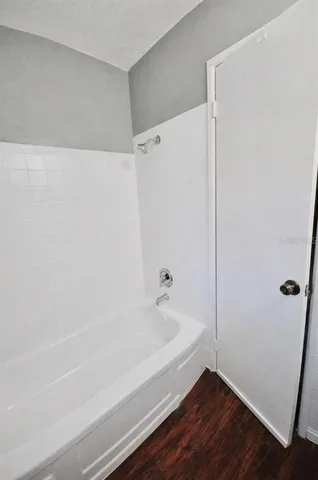 a bathroom with a bathtub and shower