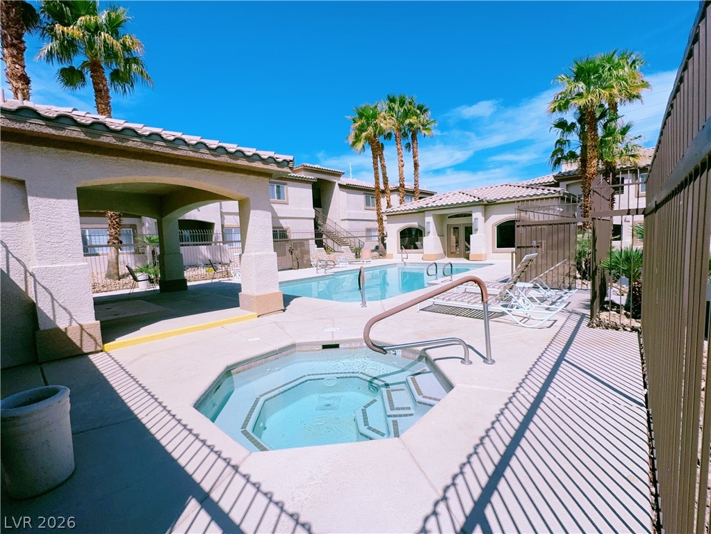 8725 West Flamingo Road, Unit 208 Las Vegas, NV 89147 - Photo 16 of 16 This inviting community offers a sparkling pool and spa, perfect for relaxation and recreation.
