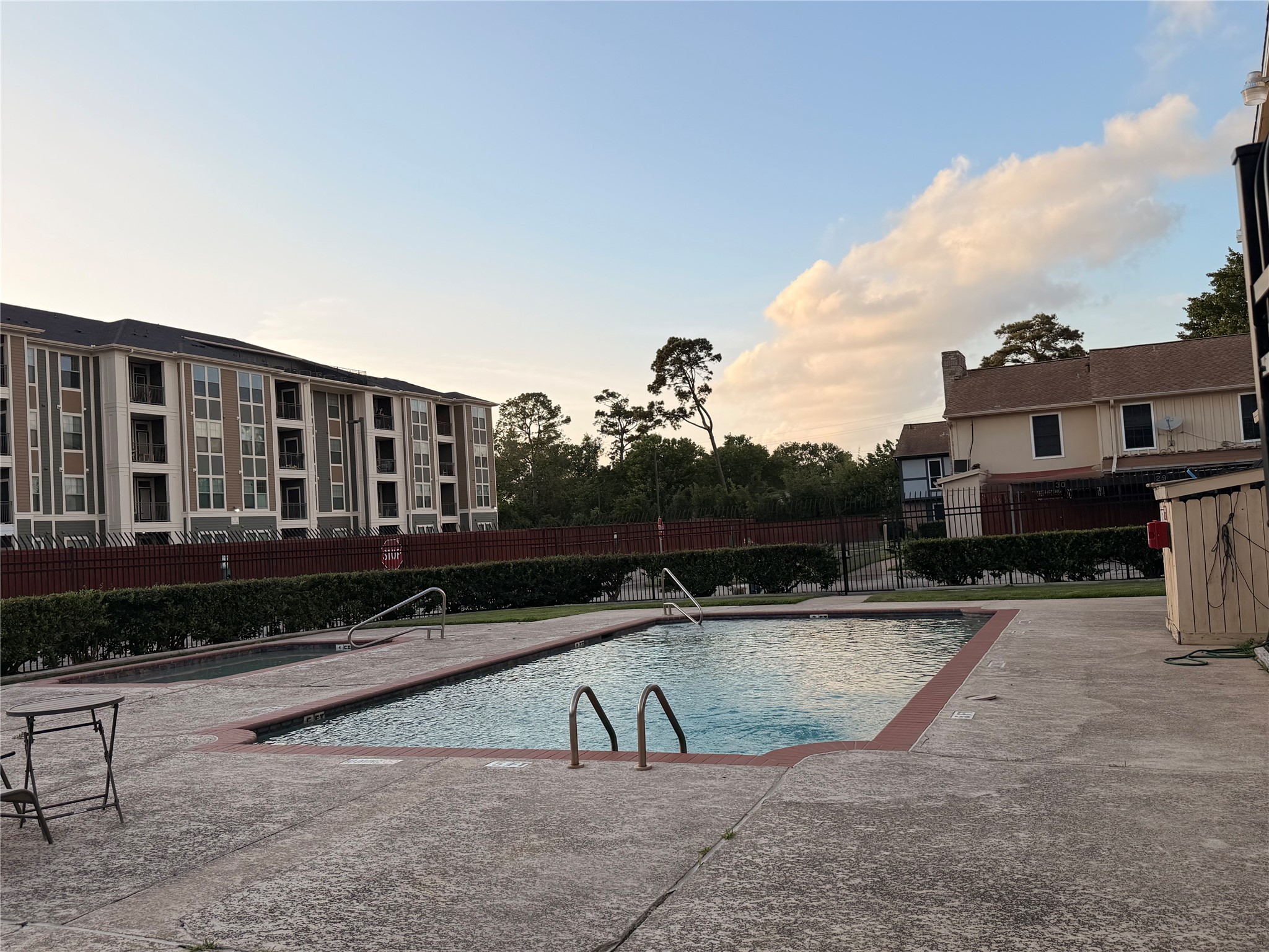 5218 Milwee Street, Unit 6 Houston, TX 77092 - Photo 16 of 17 a view of a swimming pool with a lounge chairs