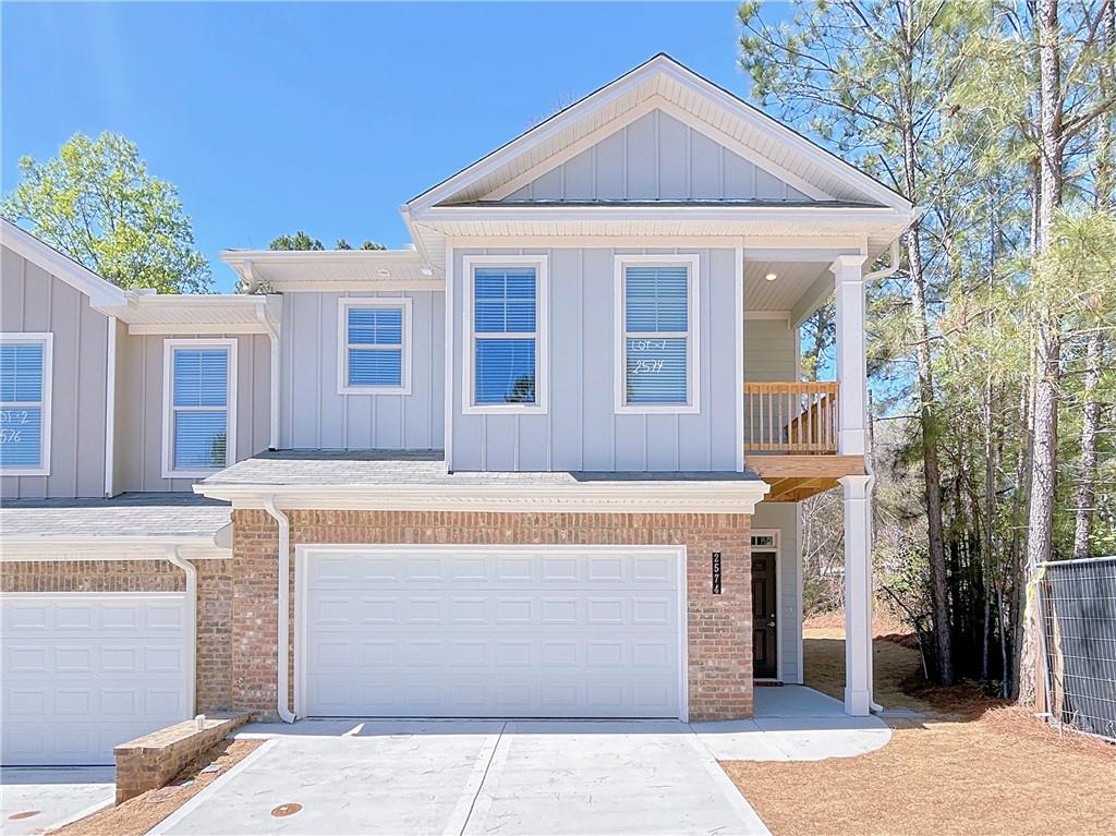 a front view of a house with a garage