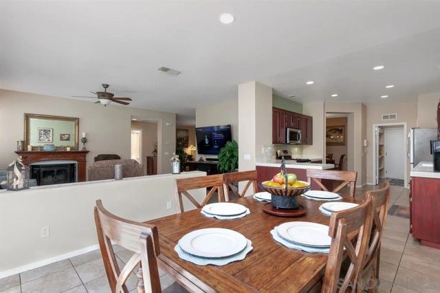 a kitchen with kitchen island granite countertop a sink dishwasher stove and refrigerator