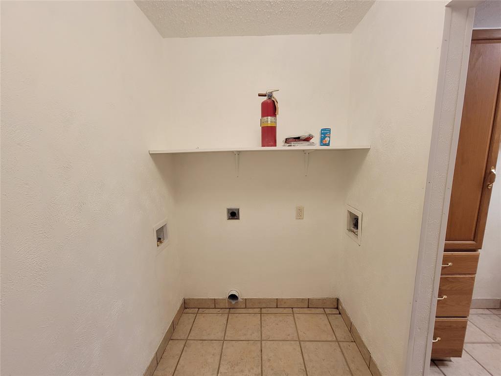 1000 Springdale Road Bedford, TX 76021 - Photo 29 of 36 Space for your own washer and dryer. Electric dryer hookup on left. Water supply on the right side, and washer drain on left side (extra-long hose will be supplied by landlord).