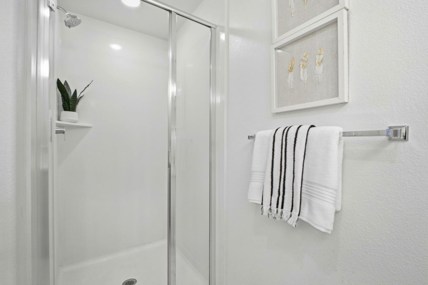 385 Line Street Hayward, CA 94544 - Photo 25 of 38 a view of a bathroom with a shower and a tub
