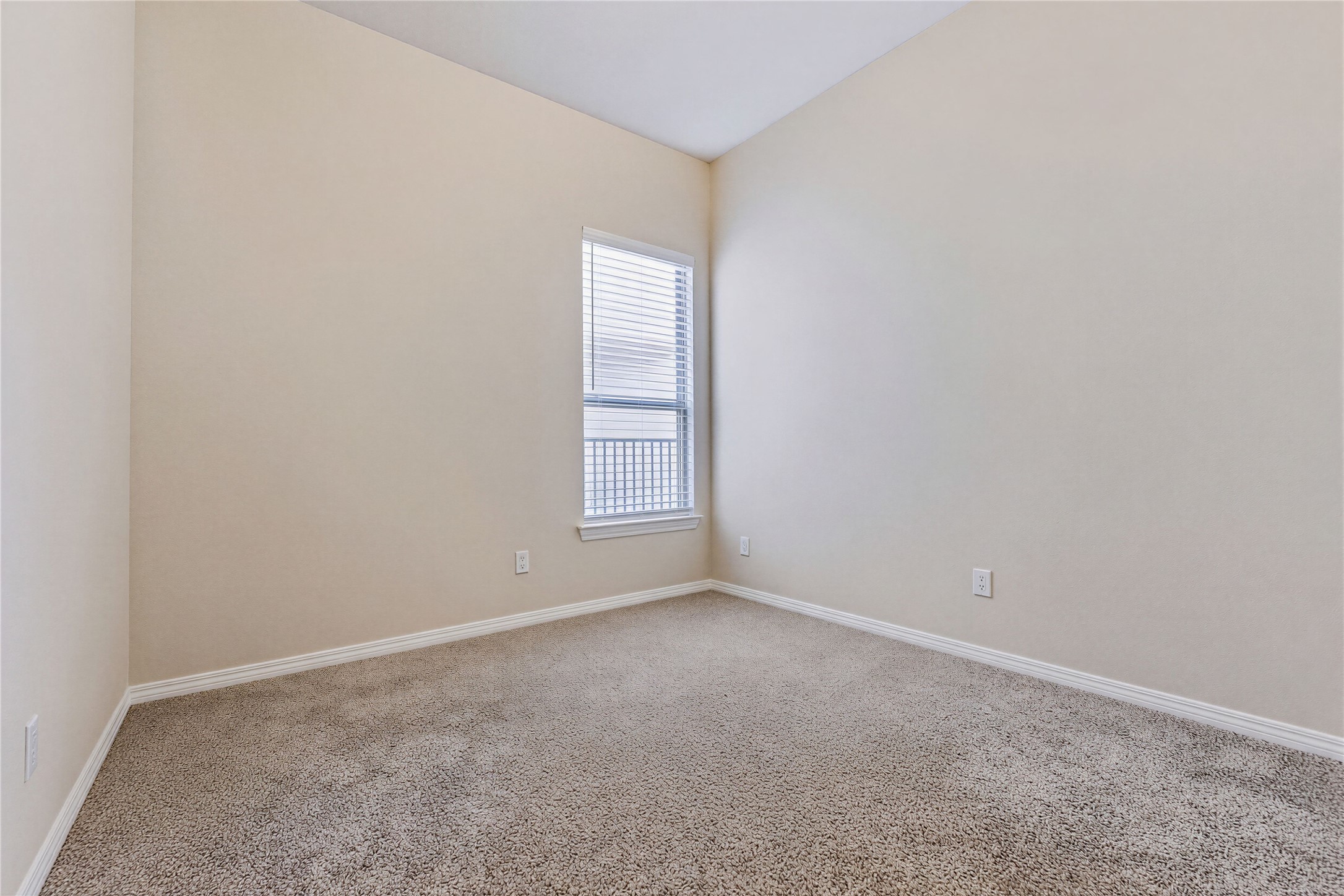 162 Rains Kyle, TX 78640 - Photo 21 of 32 Bedroom #3 featuring high vaulted ceilings and carpet.