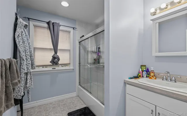 a kitchen with a refrigerator and a sink