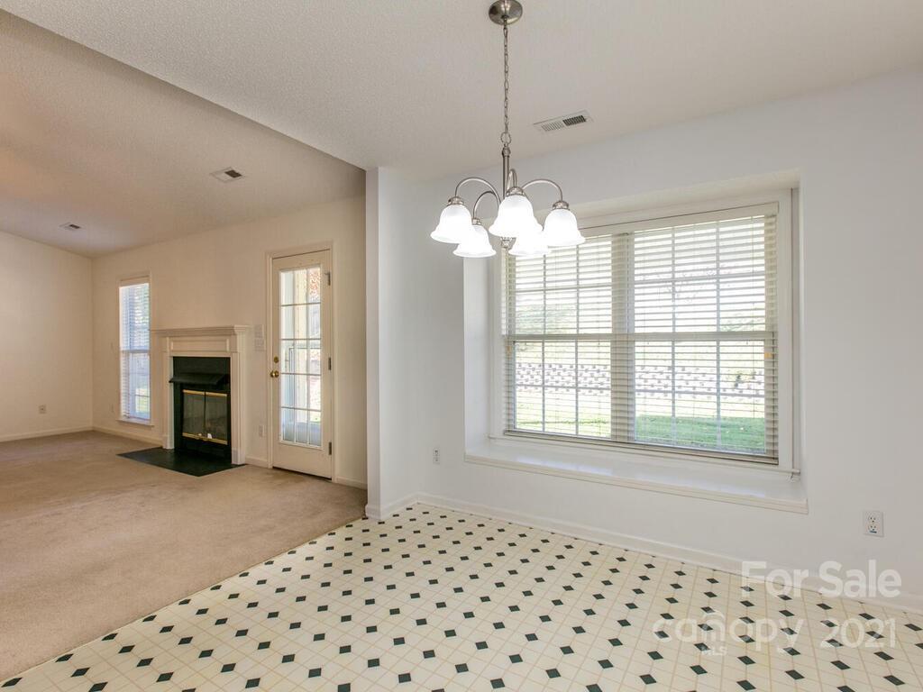 83 Planters Creek Road Fletcher, NC 28732 - Photo 14 of 38 a view of a room with a chandelier
