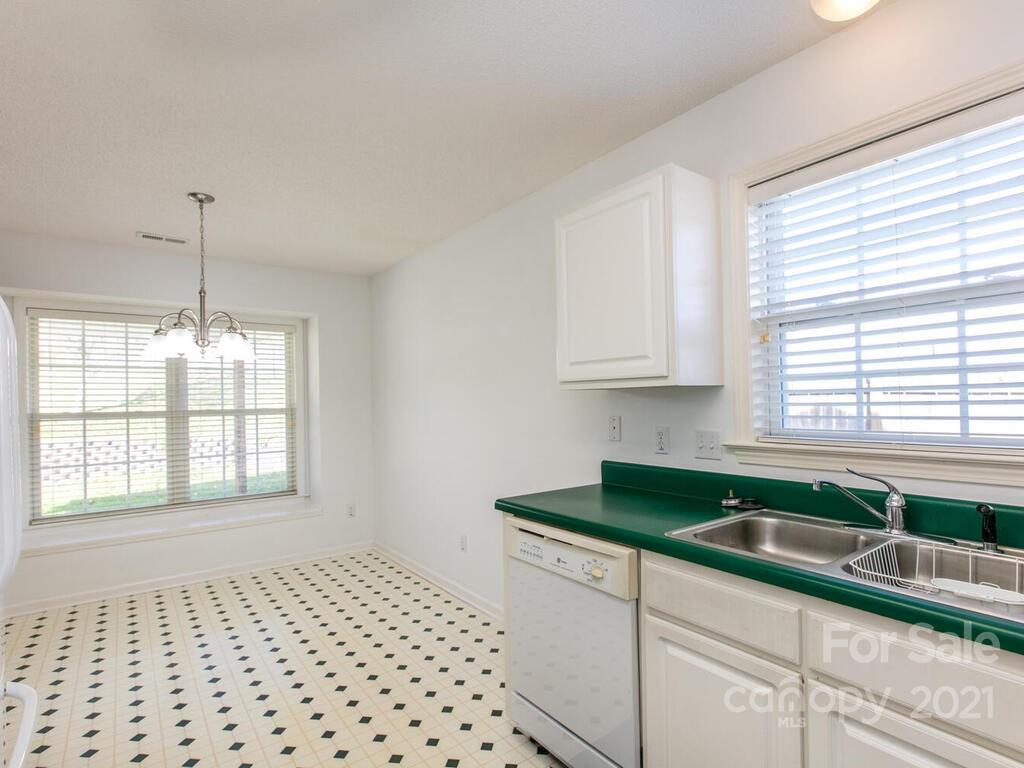 83 Planters Creek Road Fletcher, NC 28732 - Photo 18 of 38 a kitchen with a sink and cabinets