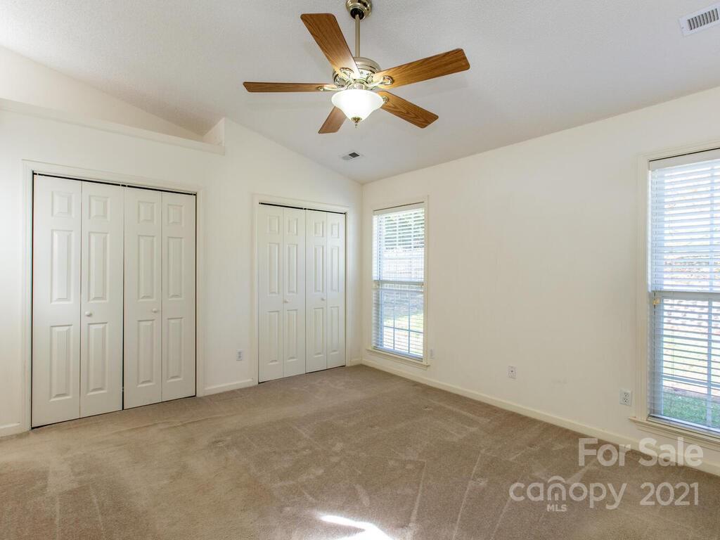 83 Planters Creek Road Fletcher, NC 28732 - Photo 19 of 38 a view of an empty room with a window
