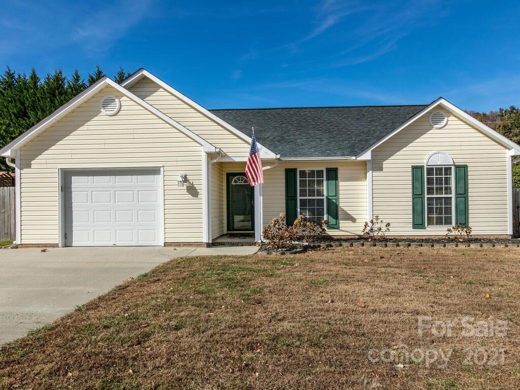 83 Planters Creek Road Fletcher, NC 28732 - Photo 3 of 38 a front view of a house with yard and seating space