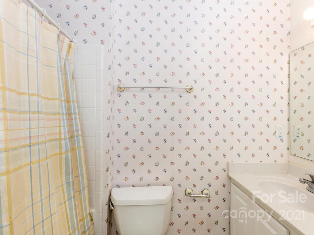 83 Planters Creek Road Fletcher, NC 28732 - Photo 22 of 38 a bathroom with a sink and a toilet