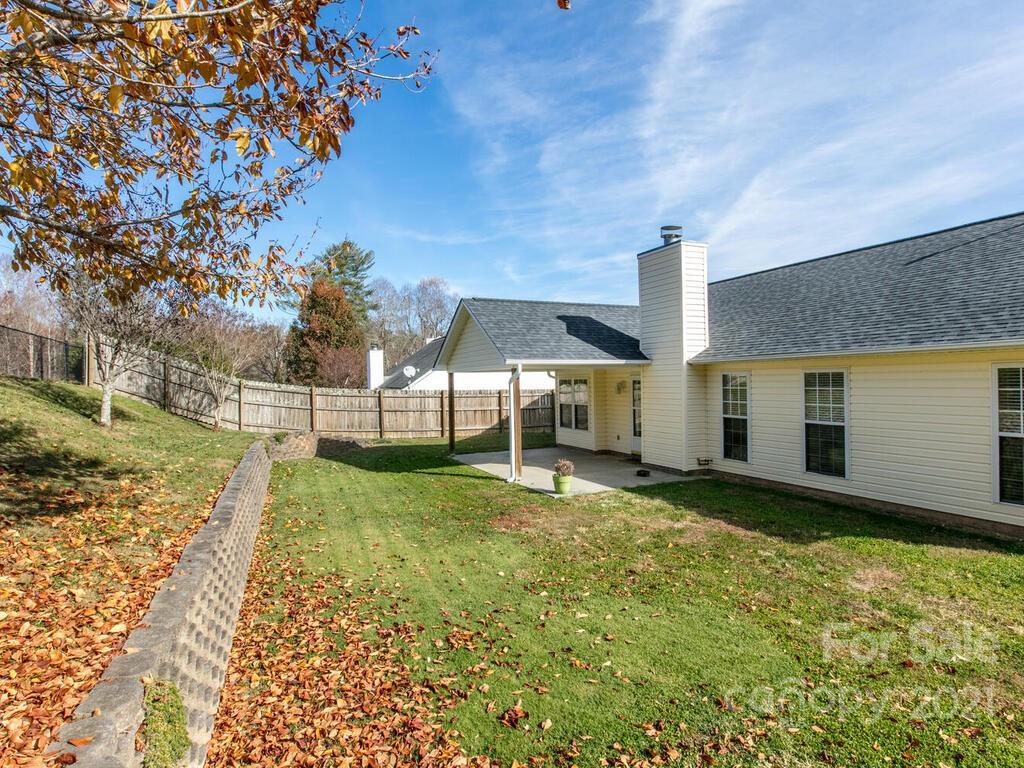 83 Planters Creek Road Fletcher, NC 28732 - Photo 4 of 38 a view of a house with backyard and sitting area