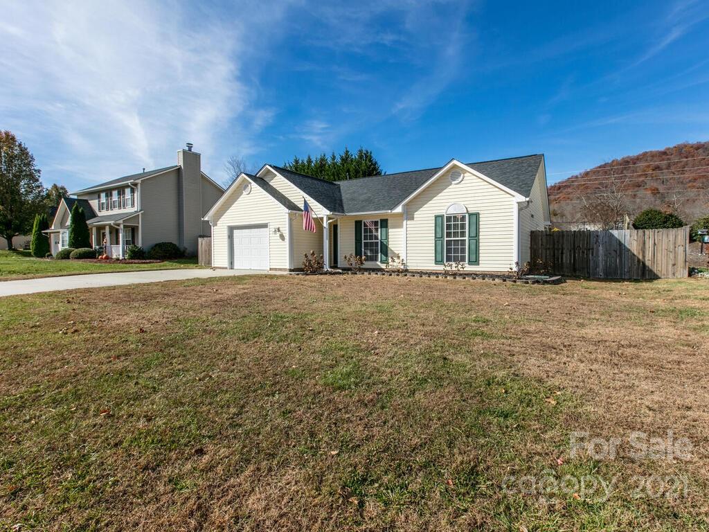 83 Planters Creek Road Fletcher, NC 28732 - Photo 5 of 38 a front view of a house with a yard