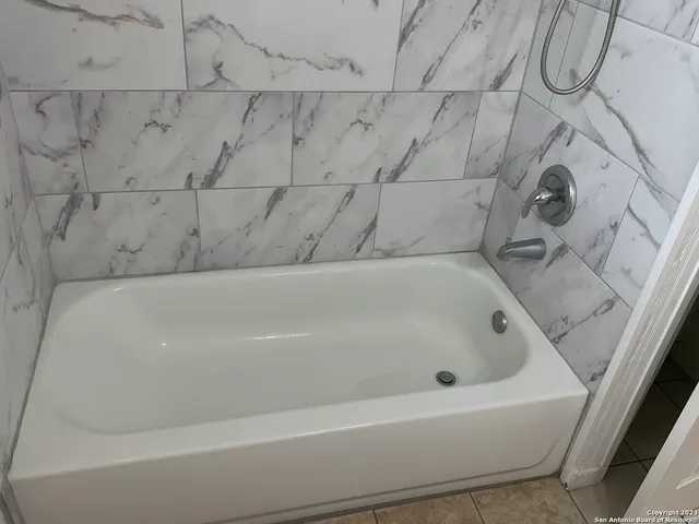 a bathroom with a bathtub