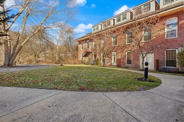 a view of a building with a yard