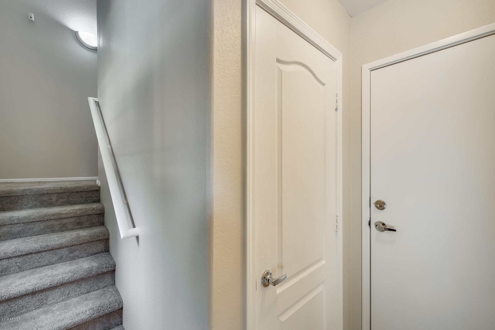 2401 East Rio Salado Parkway, Unit 1124 Tempe, AZ 85288 - Photo 9 of 32 a view of staircase with white walls and white door