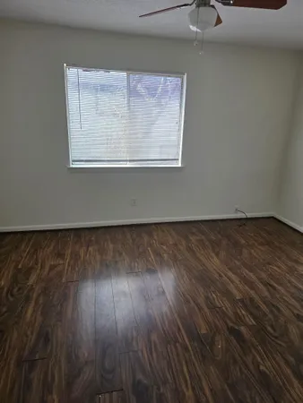 a view of wooden floor cabinets and outdoor space in back
