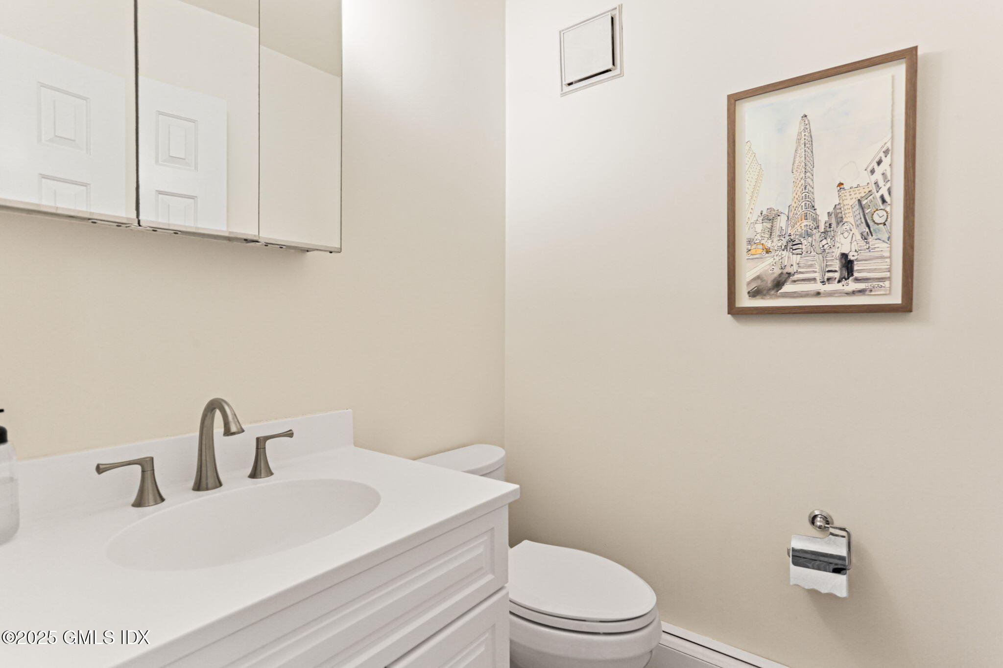 38 A Orchard Street Cos Cob, CT 06807 - Photo 11 of 26 a bathroom with a toilet a sink and mirror