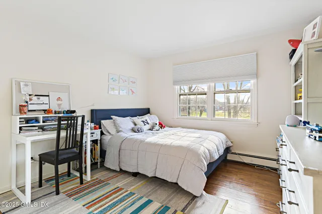 a bedroom with a bed and a table