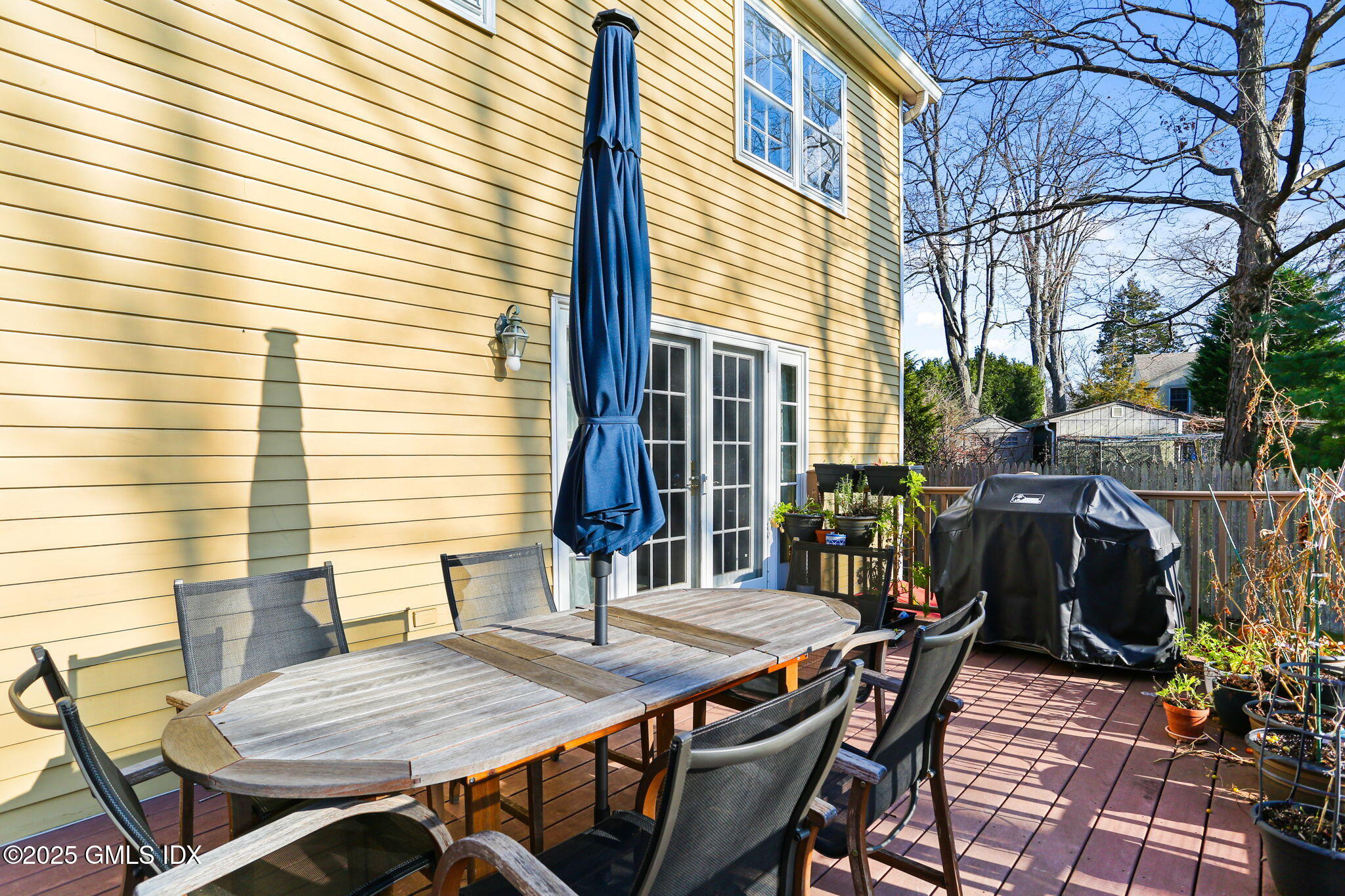 38 A Orchard Street Cos Cob, CT 06807 - Photo 22 of 26 a view of a patio with table and chairs and potted plants