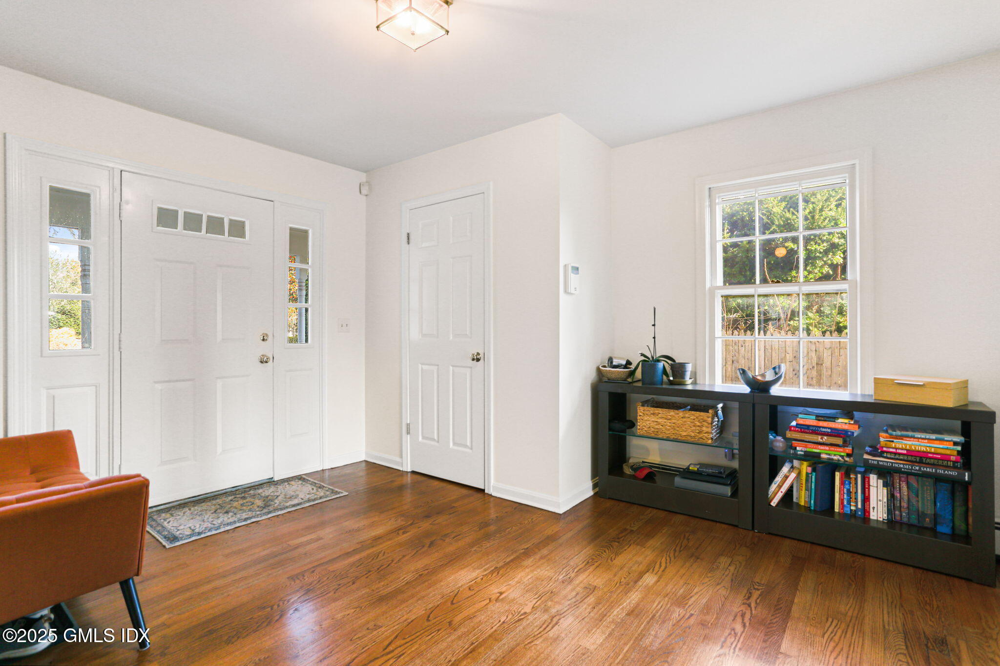 38 A Orchard Street Cos Cob, CT 06807 - Photo 3 of 26 a view of a livingroom with furniture and hardwood floor
