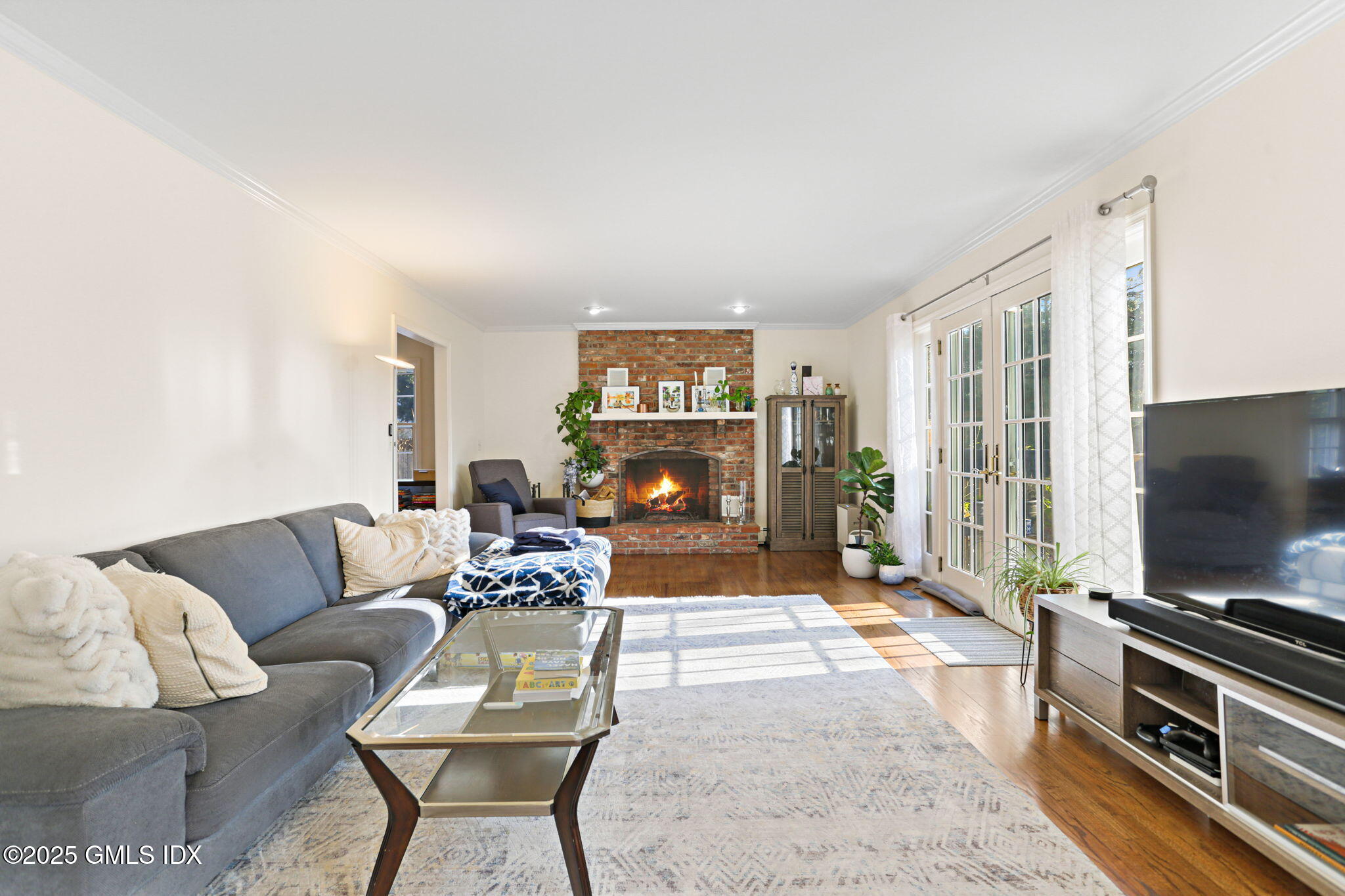 38 A Orchard Street Cos Cob, CT 06807 - Photo 6 of 26 a living room with furniture and a flat screen tv