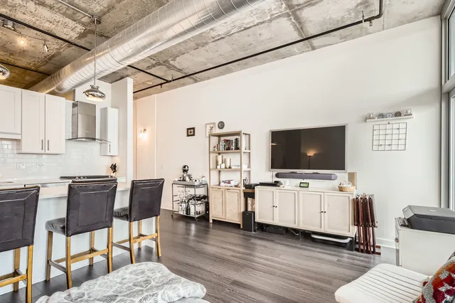 a living room with furniture and flat screen tv