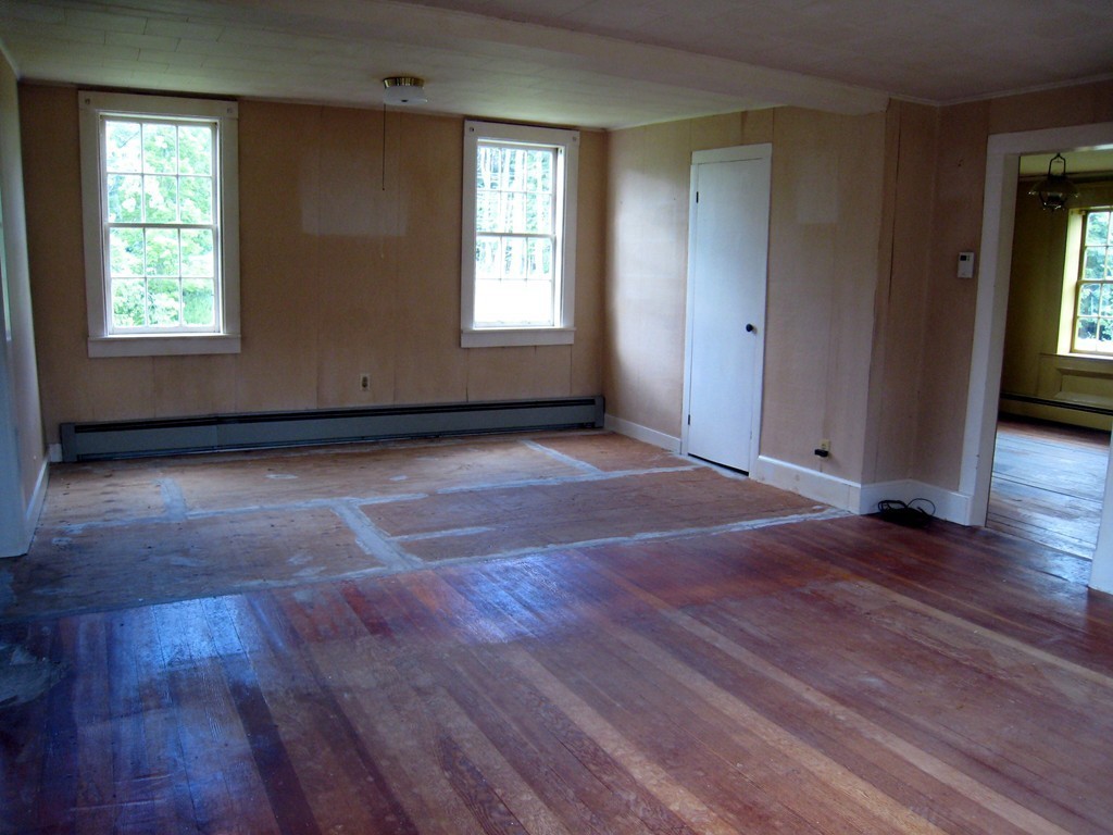 1216 Conway Road Ashfield, MA 01330 - Photo 5 of 30 an empty room with wooden floor and windows