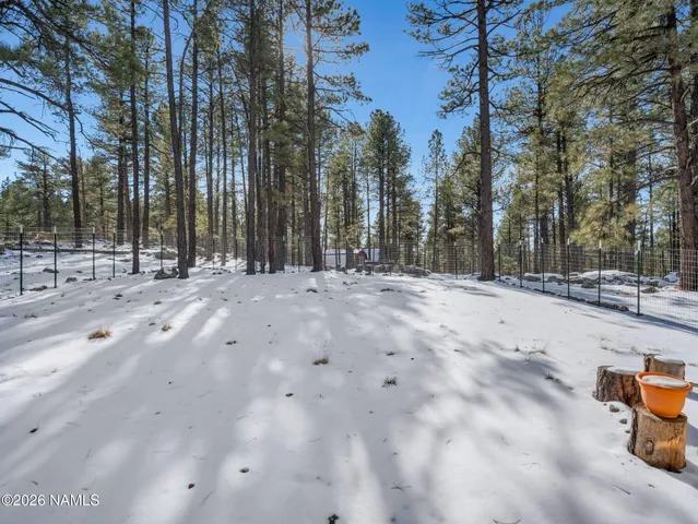 a view of a house with a snow on the road