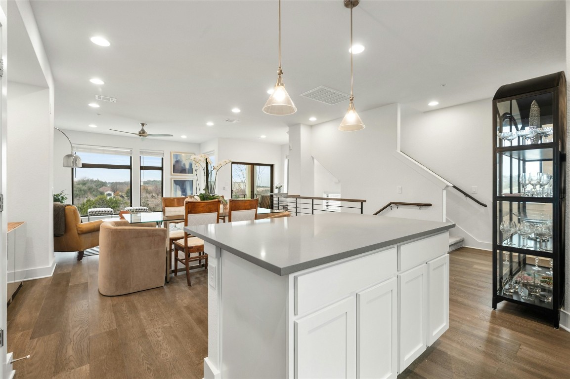 2050 Lohmans Spur Road, Unit 101 Lakeway, TX 78738 - Photo 12 of 31 an open kitchen with a sink and breakfast area