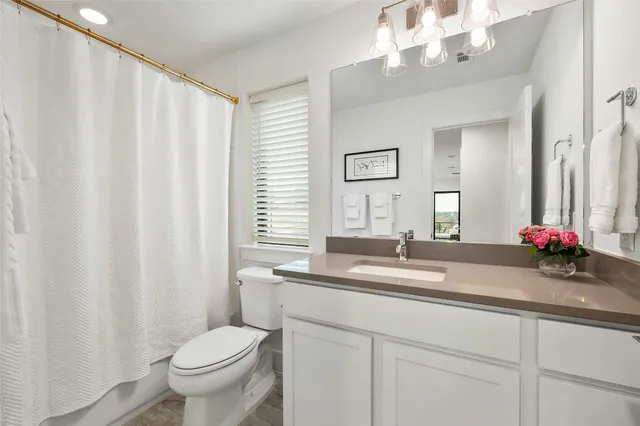 a bedroom with a bed and chair