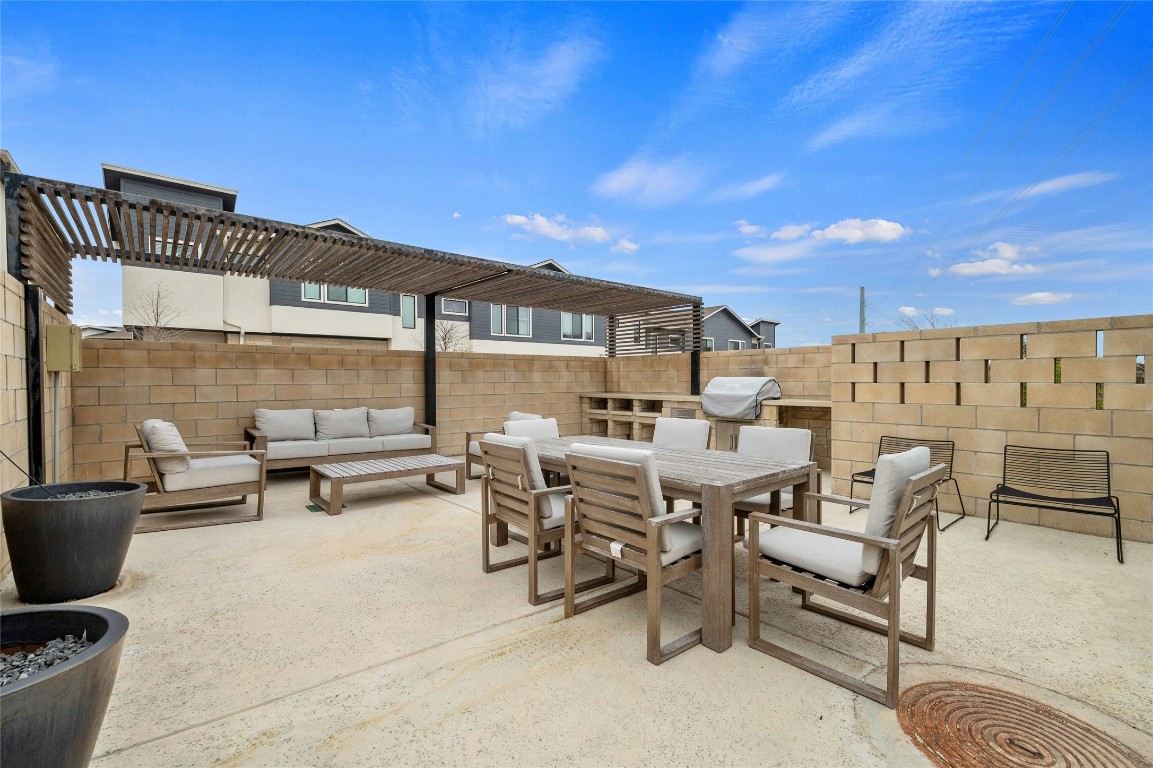2050 Lohmans Spur Road, Unit 101 Lakeway, TX 78738 - Photo 27 of 31 a view of a patio with table and chairs