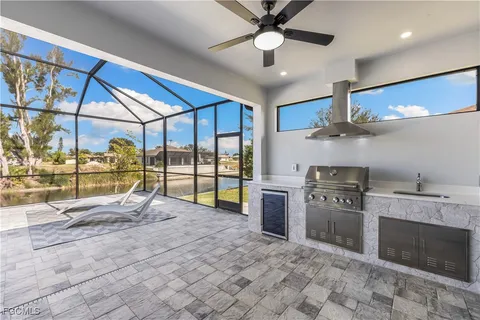 a view of a kitchen with a sink and a stove top oven