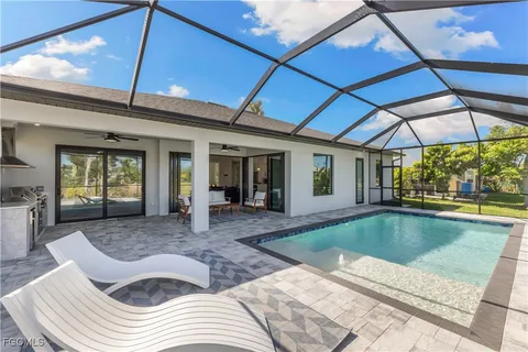 a view of swimming pool with seating space