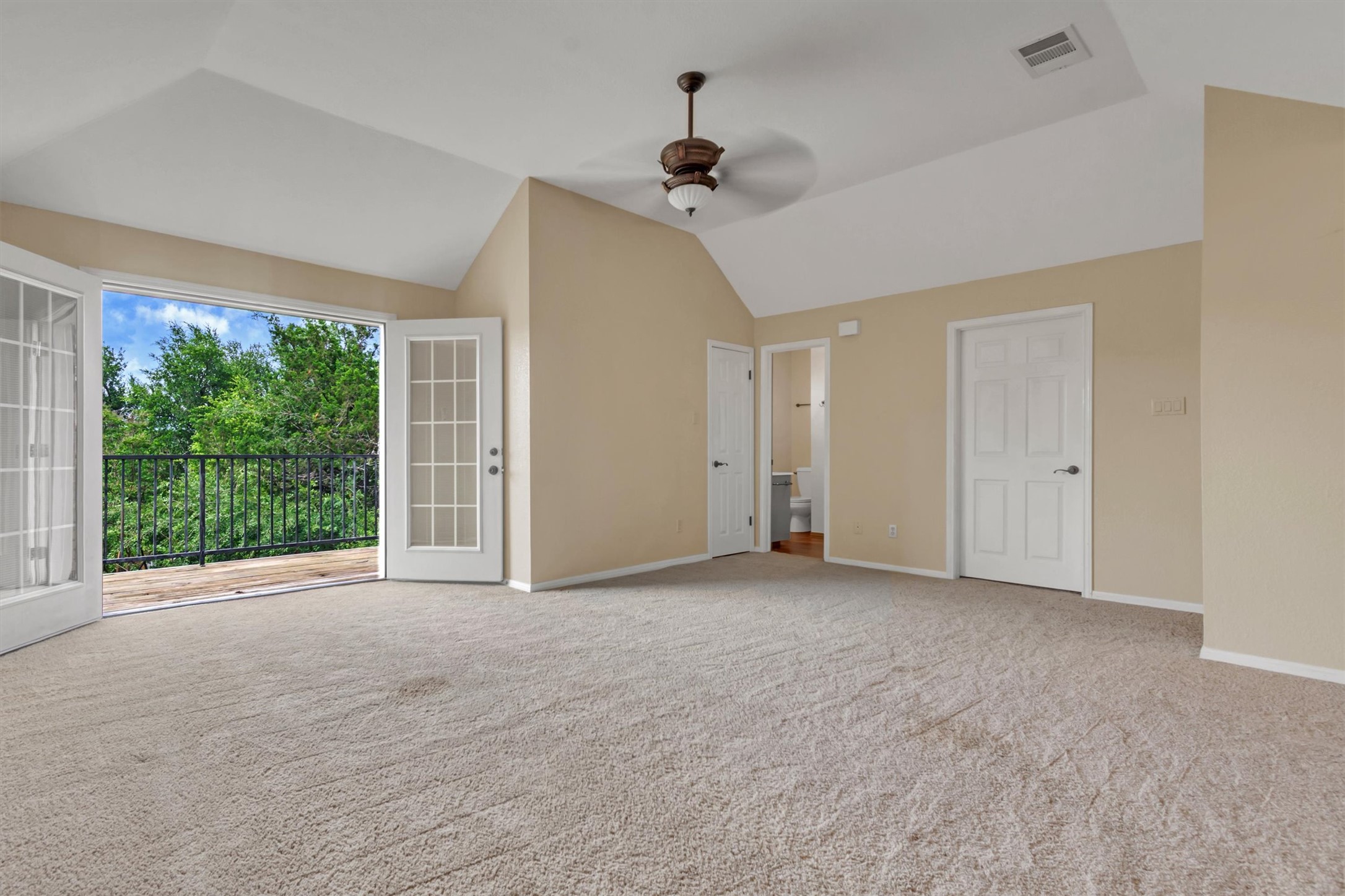 6008 Tributary Ridge Court Austin, TX 78759 - Photo 20 of 36 Step out onto the private balcony from this spacious loft offering tree-filled views.