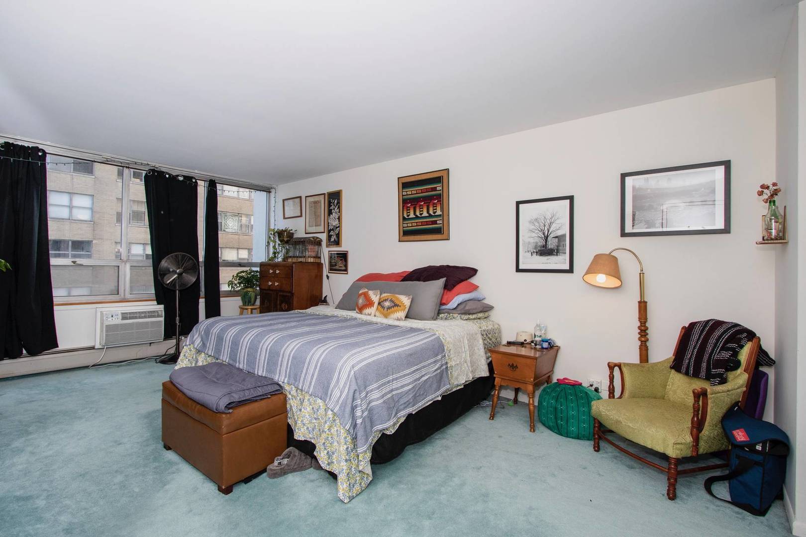 6171 North Sheridan Road, Unit 1112 Chicago, IL 60660 - Photo 8 of 16 a bedroom with a bed couch and a window
