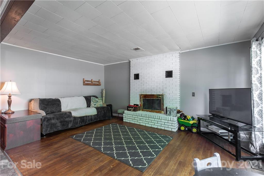 120 Ramah Church Road Clover, SC 29710 - Photo 13 of 18 a living room with furniture a flat screen tv and a fireplace