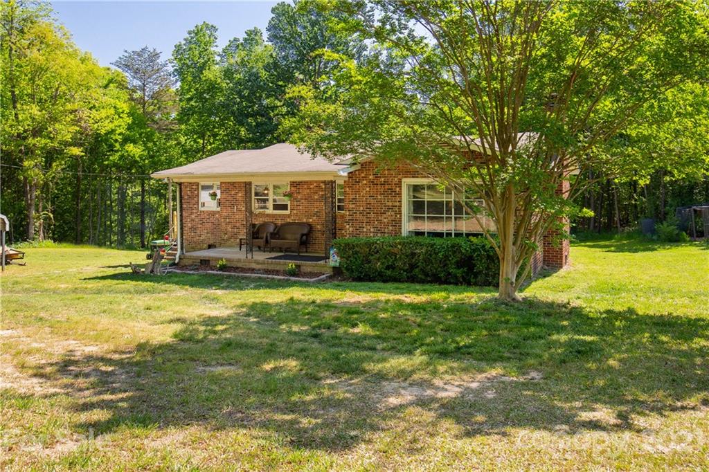 120 Ramah Church Road Clover, SC 29710 - Photo 3 of 18 a backyard of a house with yard and outdoor seating