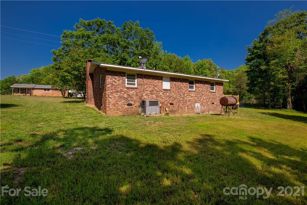 120 Ramah Church Road Clover, SC 29710 - Photo 6 of 18 a view of a back yard of the house with green space and porch area