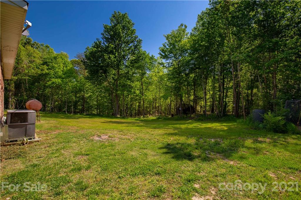 120 Ramah Church Road Clover, SC 29710 - Photo 7 of 18 a backyard of a house with table and chairs