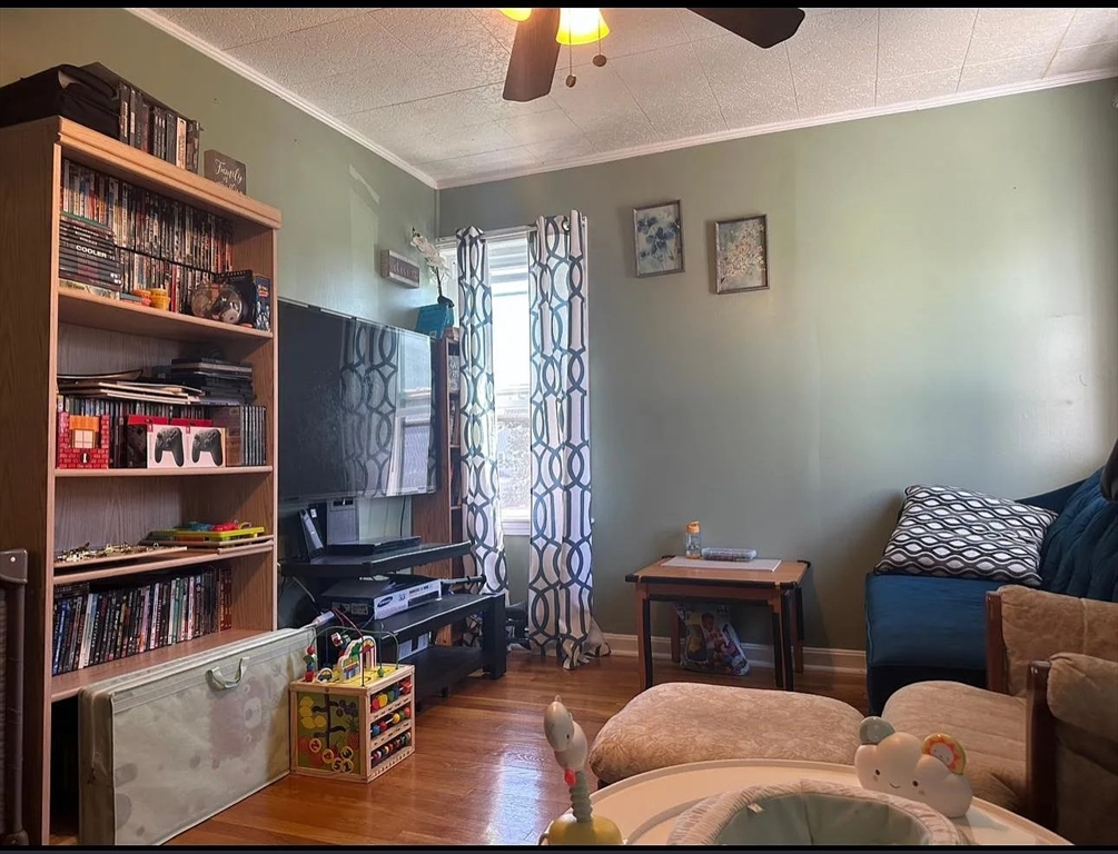 a living room with furniture cabinets and a book shelf