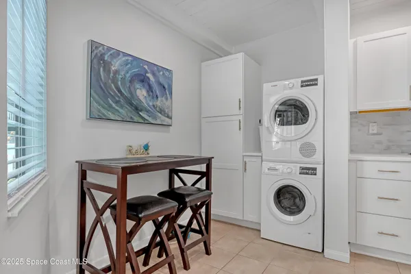 a view of a room with furniture and washer