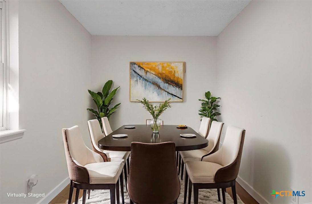 914 Edwards Street Copperas Cove, TX 76522 - Photo 8 of 13 a view of a dining room with furniture and wooden floor